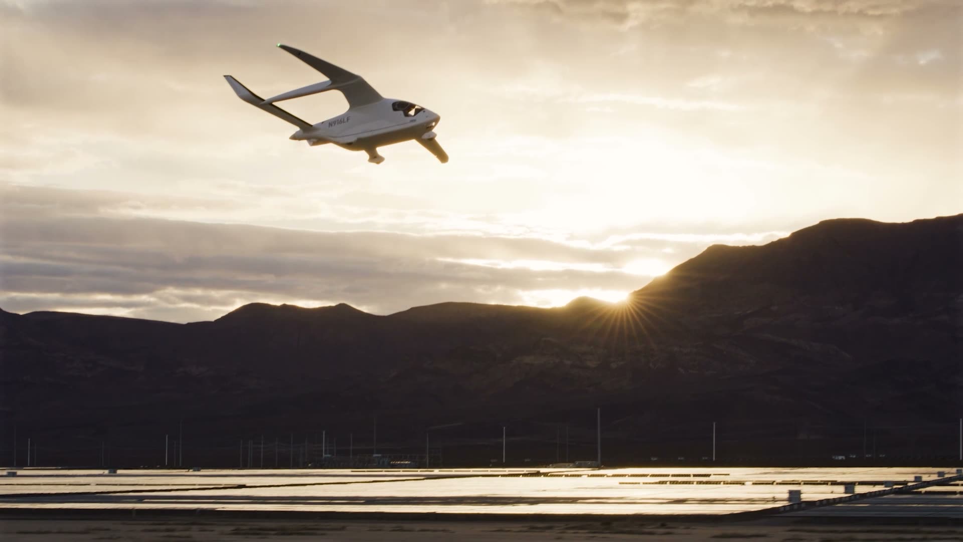 BETA Alia CX300 electric aircraft climbing out at sunset